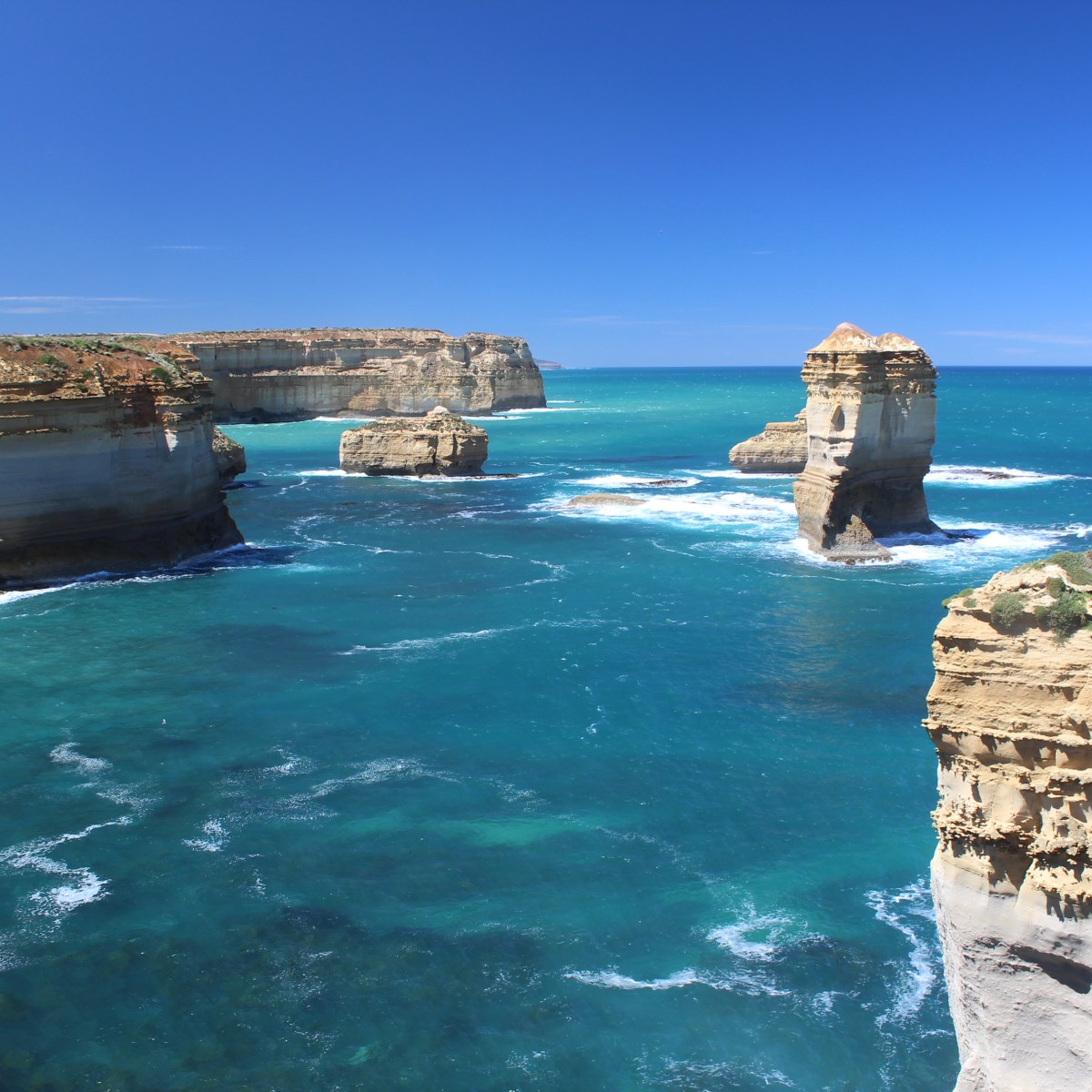 Double Arch at Loch Ard Gorge with brightly coloured water