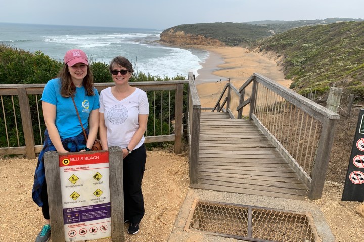 a person standing in front of a beach